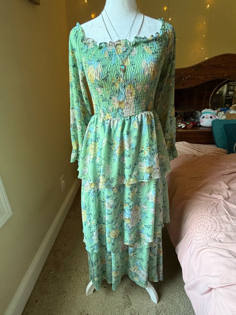 A gorgeous mint green maxi dress featuring a botanical floral pattern.